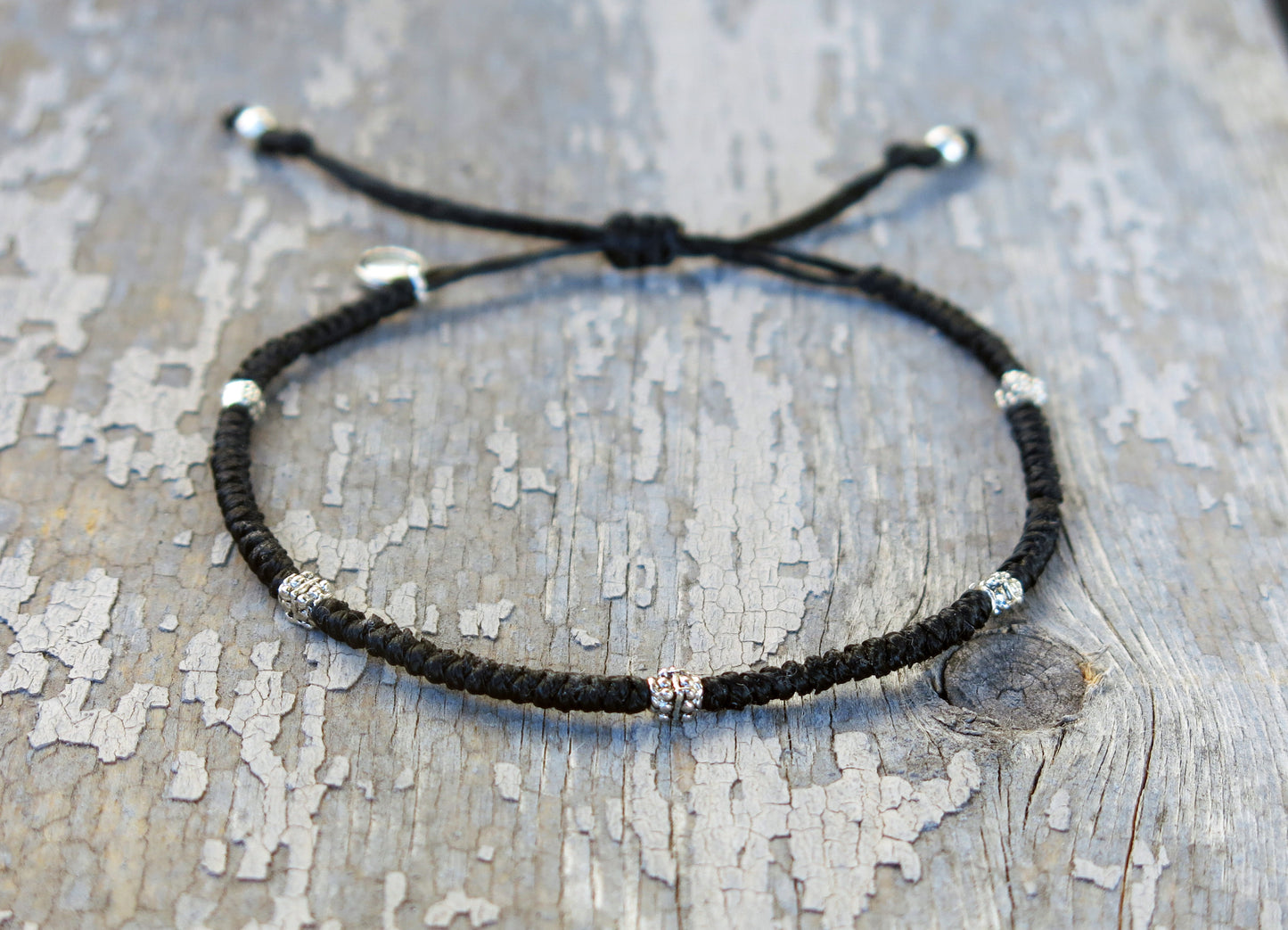 AZOE - Minimalist knotted bracelet with adjustable sliding knot for closure.