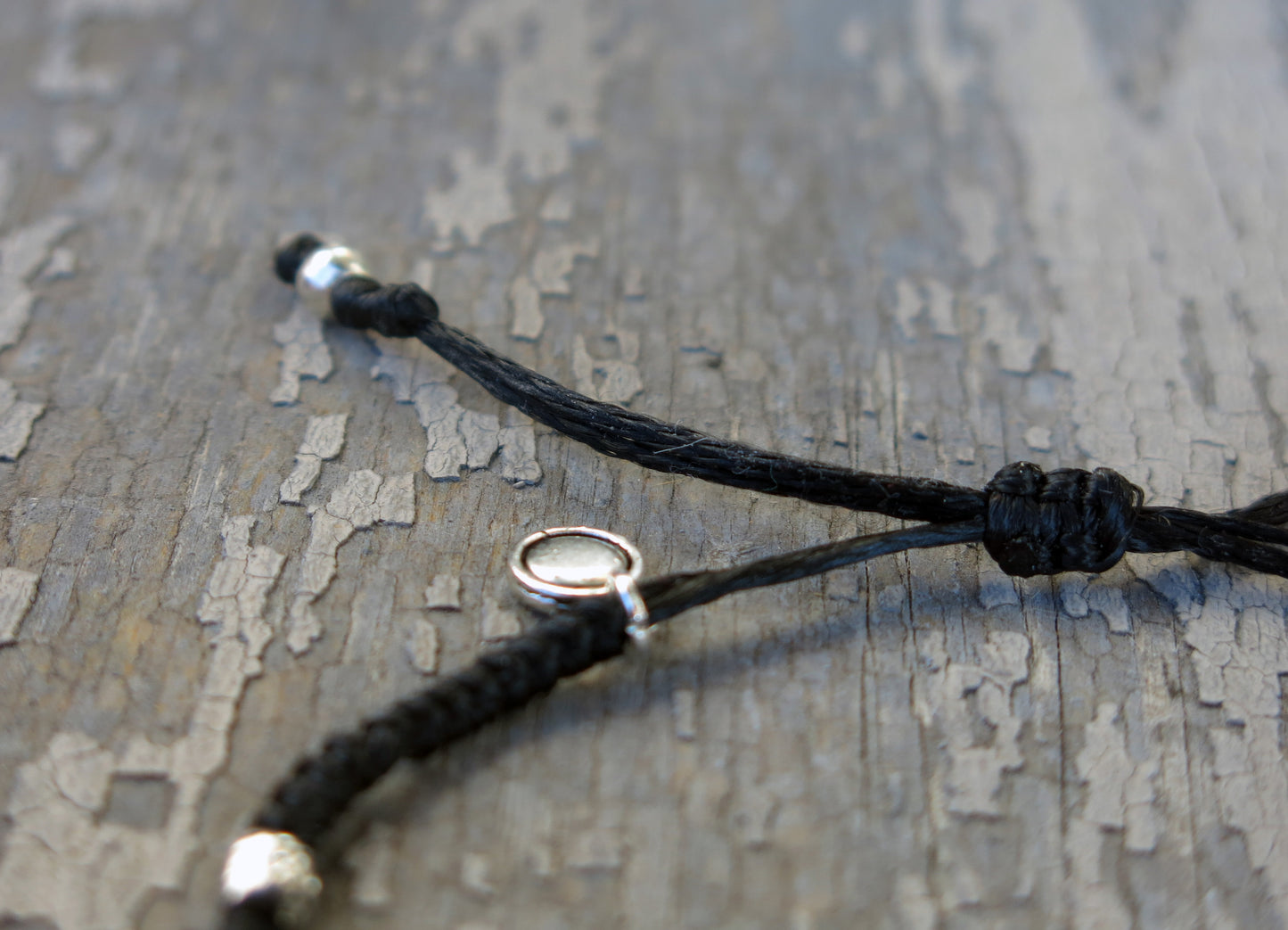 AZOE - Minimalist knotted bracelet with adjustable sliding knot for closure.