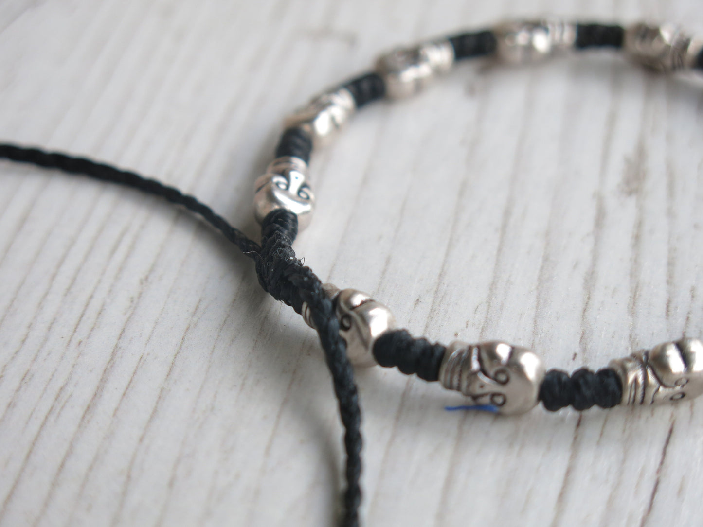 DEADHEAD - knotted bracelet with Skull beads and adjustable sliding knot for closure.